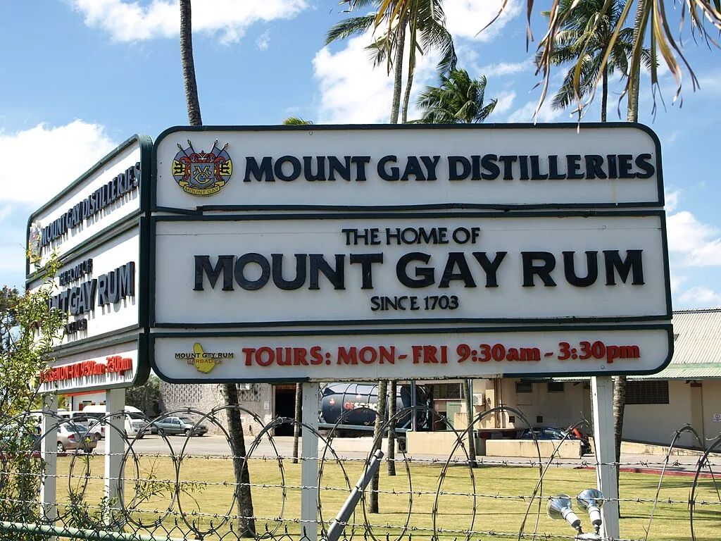 1024px MountGayRum SignInFrontOfBuilding March12 09
